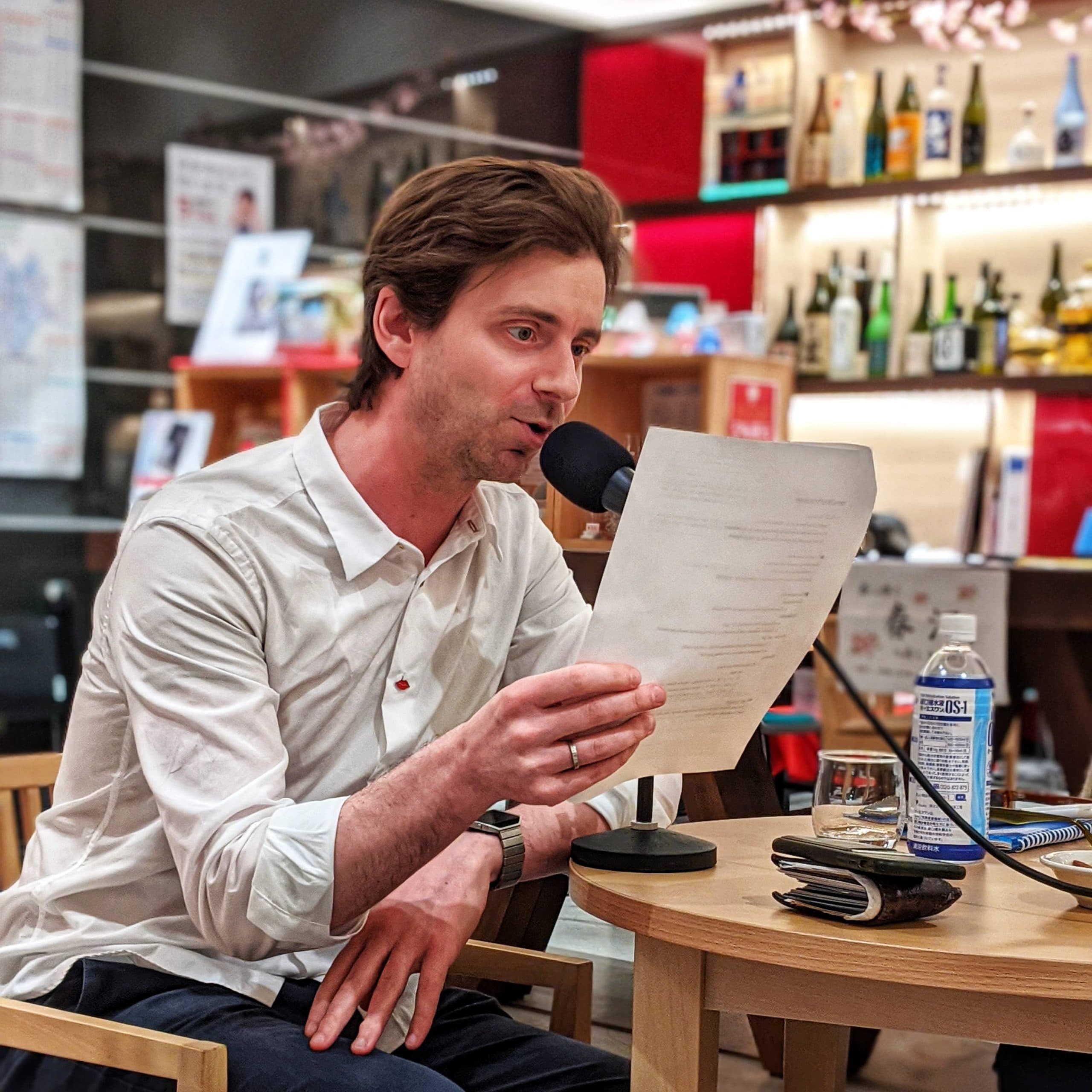 Picture of Chris Pellegrini reading a paper